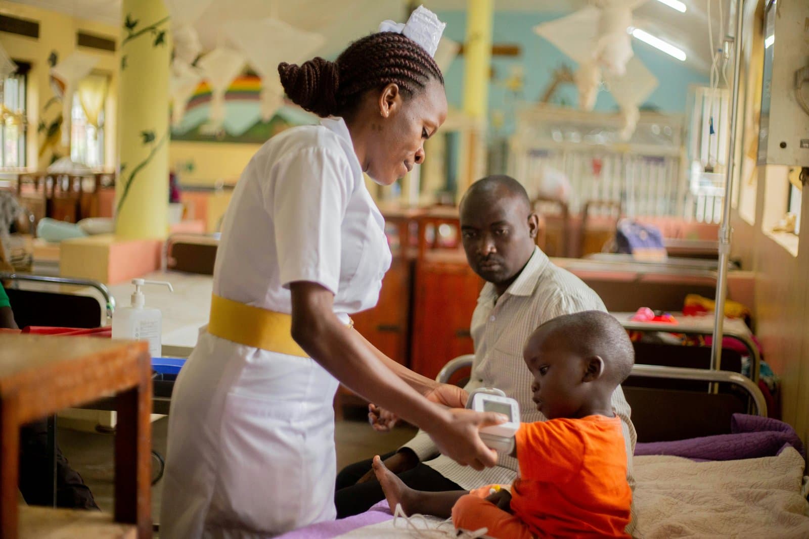 A nurse caring for a child in Nigeria